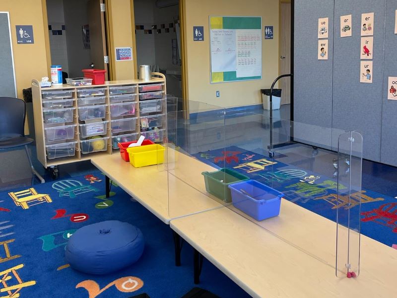 classroom at Beclabito Day School with colorful carpet and tables