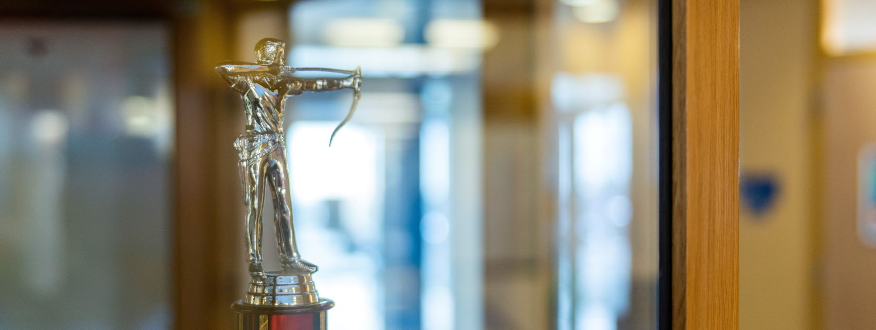 Archery trophy on display at the school, waiting to be admired and celebrated by everyone.